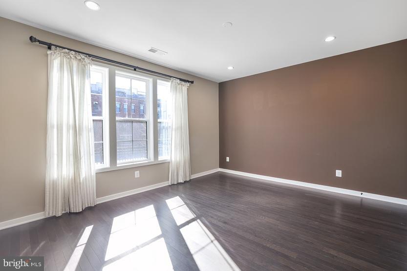 22170 Penelope Heights Terrace Ashburn, VA 20148 - Photo 6 of 61 a view of an empty room with wooden floor and a window