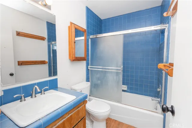 a view of a porch with wooden floor and stairs
