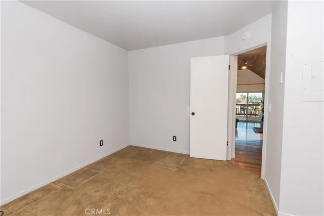 a hallway with a sink and a washer dryer