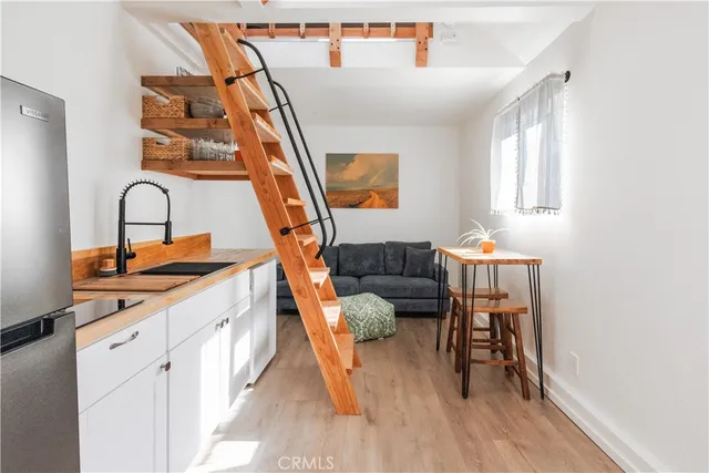 a view of an entryway with wooden floor