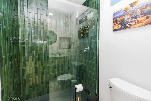 an aerial view of a houses with street