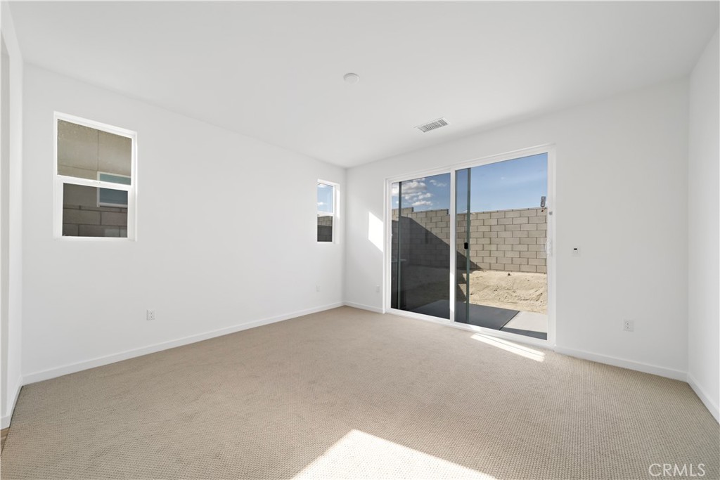 280 Mustang Lane Palm Springs, CA 92262 - Photo 12 of 12 a view of an empty room with a window