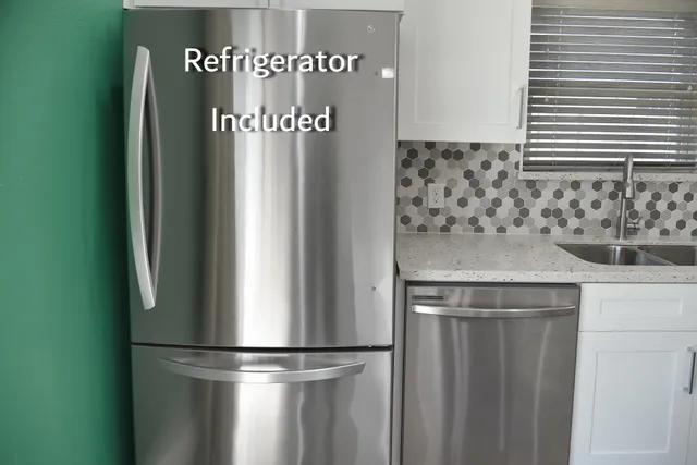 a bedroom with a bed and a chandelier fan