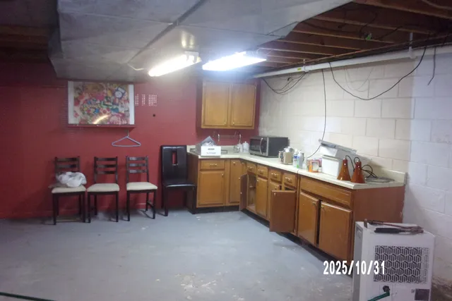 a kitchen that has a sink and cabinets
