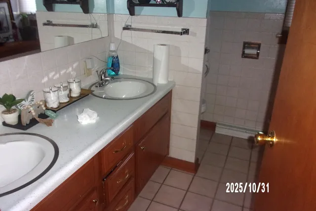 a bathroom with a sink a vanity and a mirror