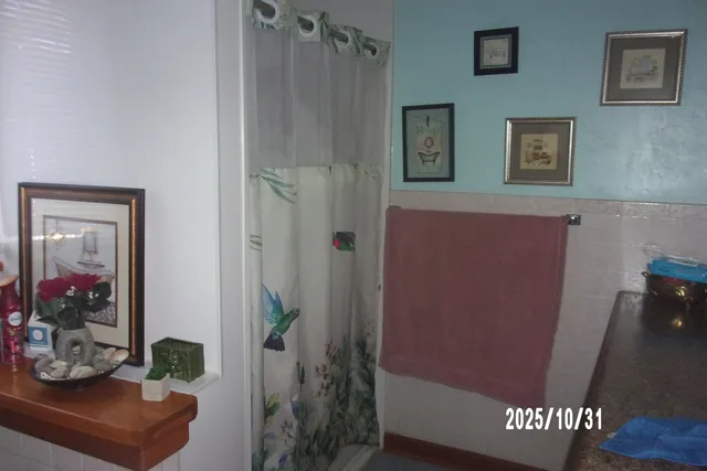 a view of a hallway with bathroom