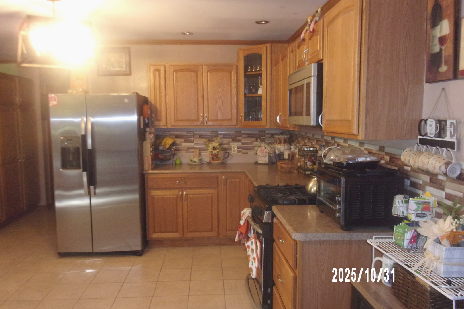 407 East Pine Street Chatsworth, IL 60921 - Photo 8 of 27 a kitchen with refrigerator and cabinets