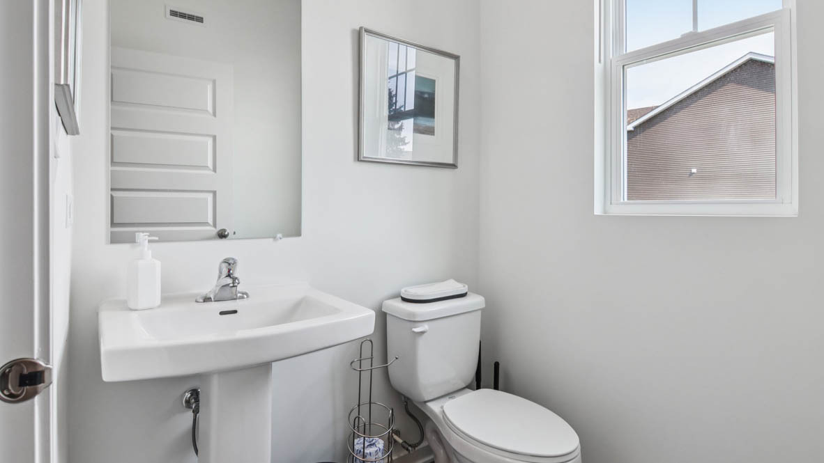 1871 Keating Drive Aurora, IL 60503 - Photo 15 of 27 a bathroom with a sink mirror and toilet