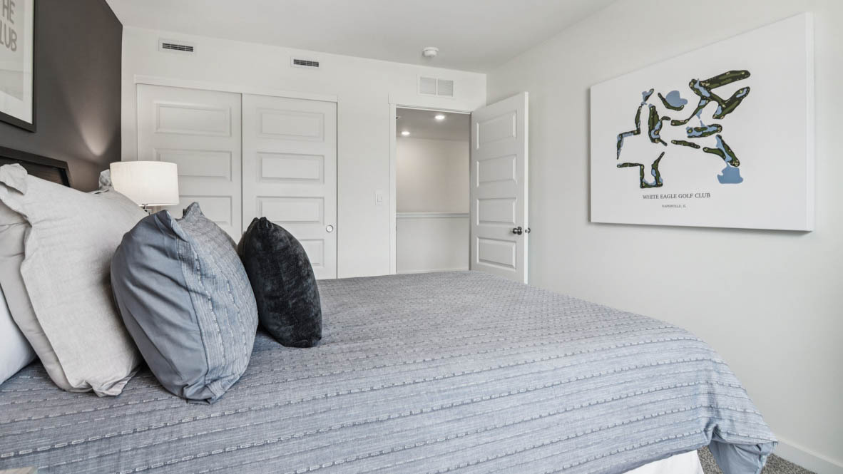 1871 Keating Drive Aurora, IL 60503 - Photo 21 of 27 a bedroom with a bed and a painting on the wall