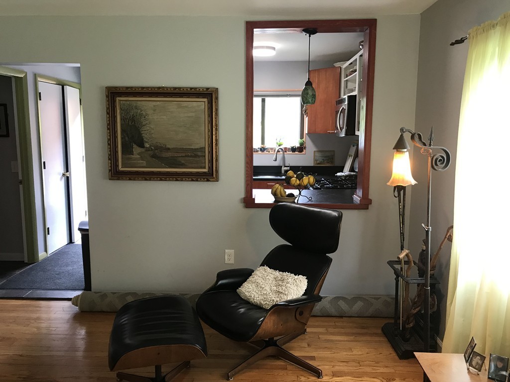 75 Spaulding Street, Unit 75 Amherst, MA 01002 - Photo 12 of 36 a living room with furniture and wooden floor