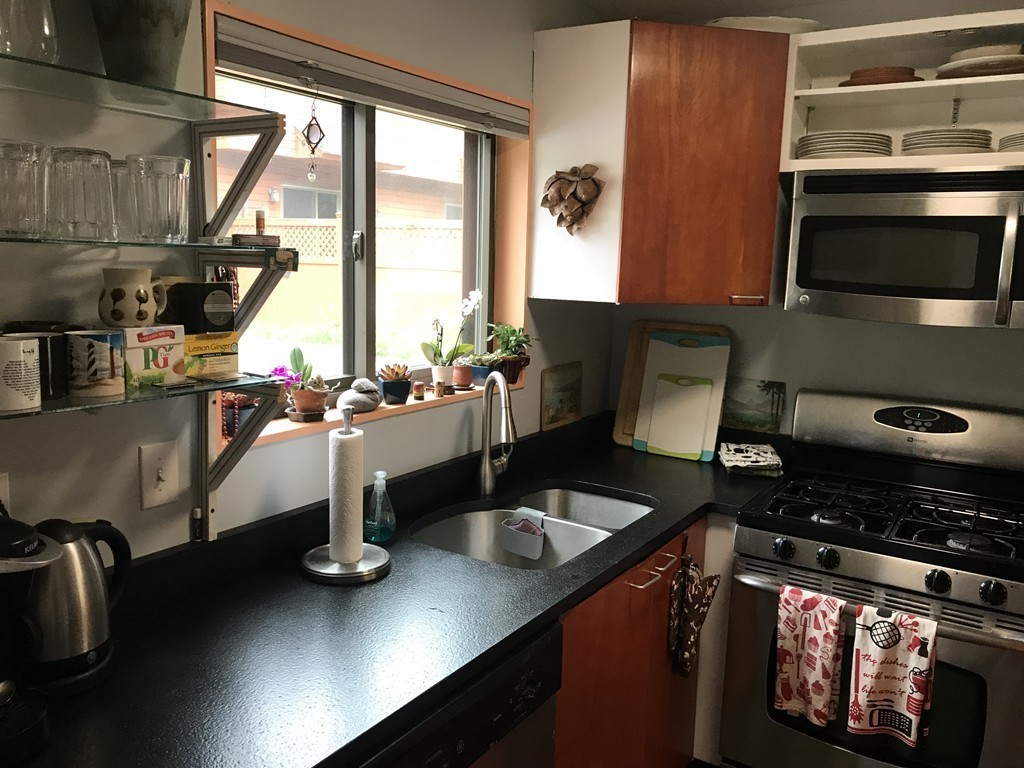 75 Spaulding Street, Unit 75 Amherst, MA 01002 - Photo 13 of 36 a kitchen with a sink and a stove top oven