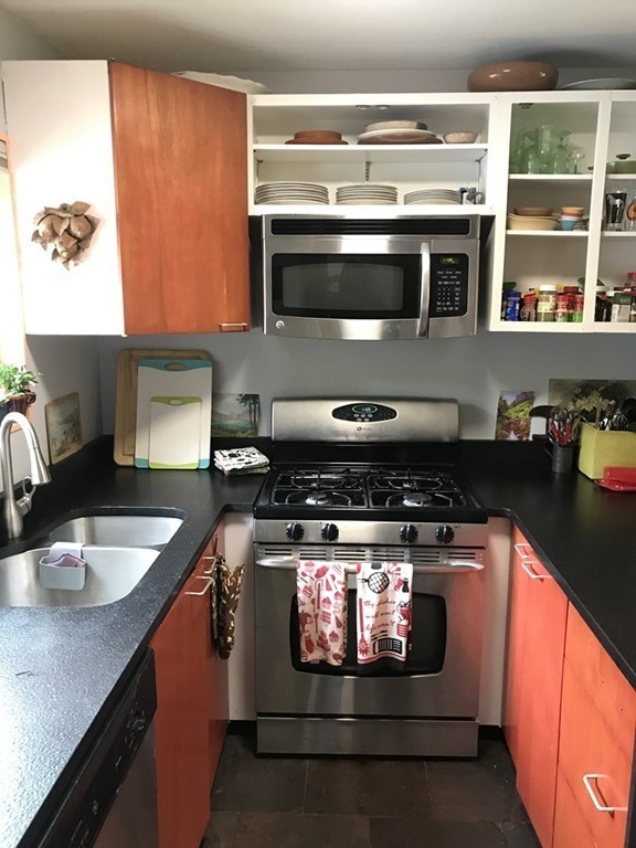 75 Spaulding Street, Unit 75 Amherst, MA 01002 - Photo 14 of 36 a kitchen with stainless steel appliances granite countertop a stove and a sink
