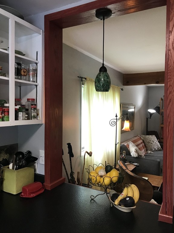75 Spaulding Street, Unit 75 Amherst, MA 01002 - Photo 15 of 36 a living room with furniture and a chandelier