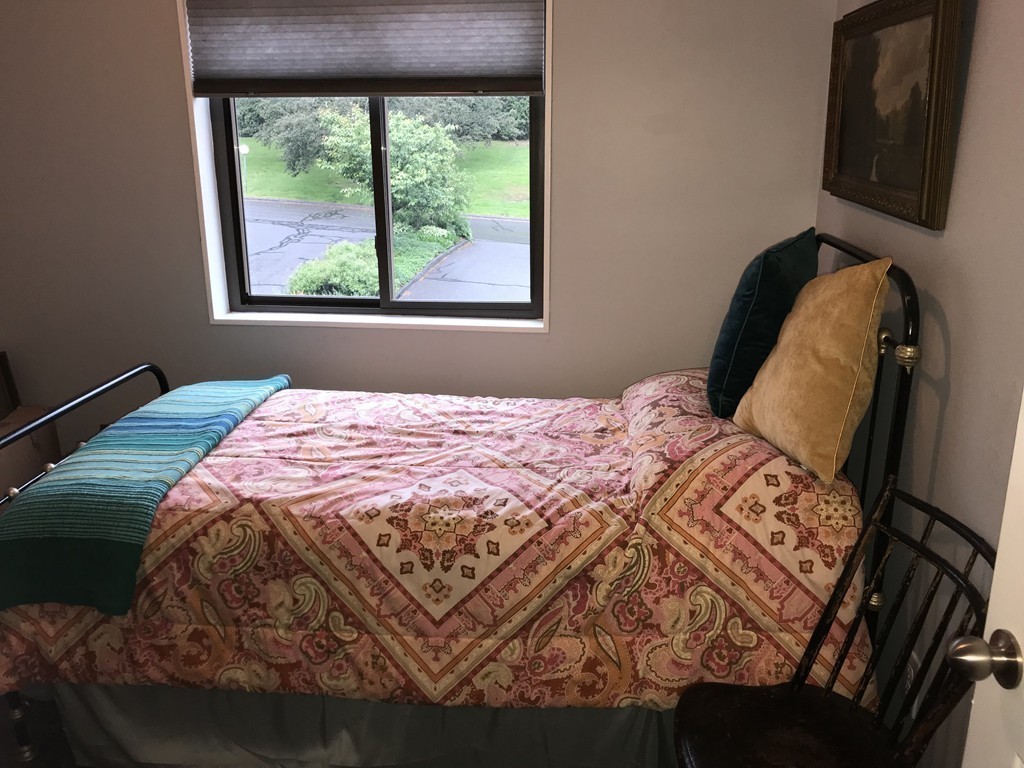 75 Spaulding Street, Unit 75 Amherst, MA 01002 - Photo 23 of 36 a bedroom with a bed and a window