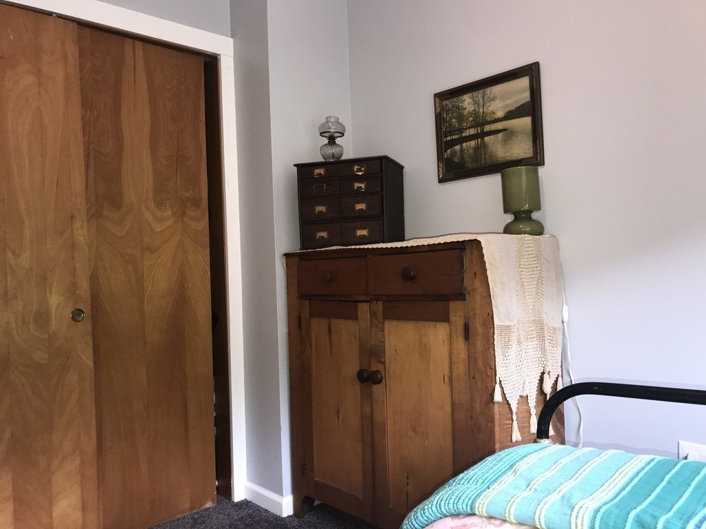 75 Spaulding Street, Unit 75 Amherst, MA 01002 - Photo 24 of 36 a bedroom with a bed and teddy bear on the dresser