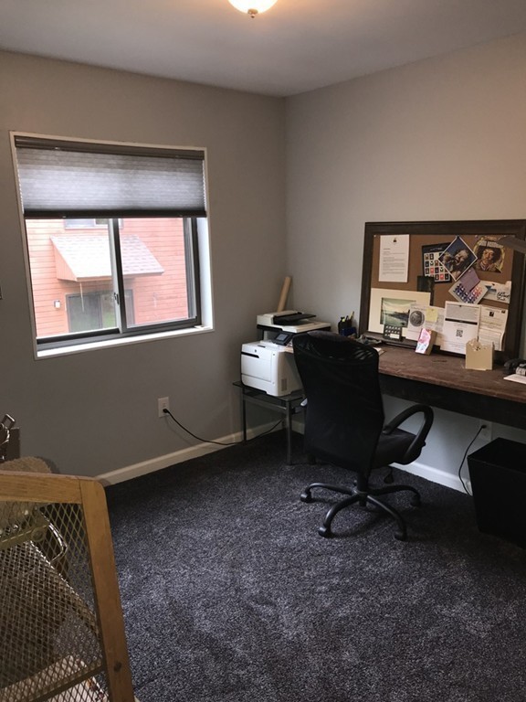 75 Spaulding Street, Unit 75 Amherst, MA 01002 - Photo 26 of 36 a view of a workspace with furniture and a window