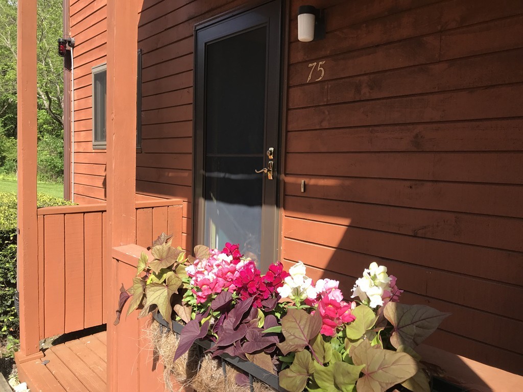 75 Spaulding Street, Unit 75 Amherst, MA 01002 - Photo 33 of 36 a view of a house with a flower garden