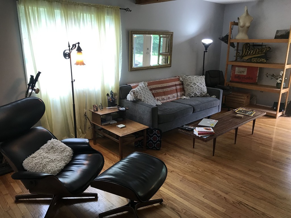 75 Spaulding Street, Unit 75 Amherst, MA 01002 - Photo 5 of 36 a living room with furniture and wooden floor