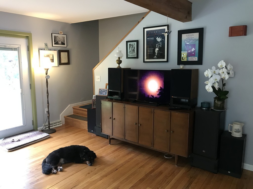 75 Spaulding Street, Unit 75 Amherst, MA 01002 - Photo 6 of 36 a living room with furniture and a flat screen tv