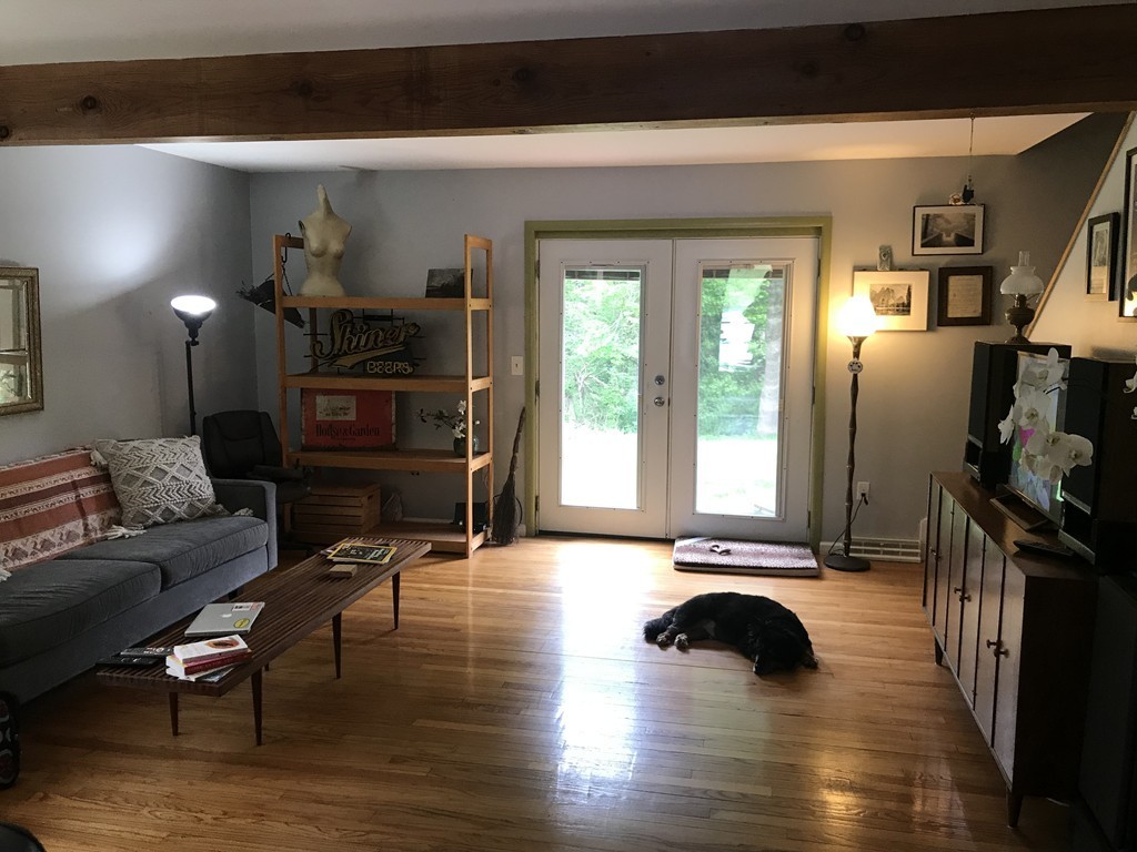 75 Spaulding Street, Unit 75 Amherst, MA 01002 - Photo 8 of 36 a view of a livingroom with furniture and an empty room