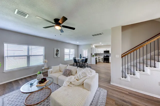 a living room with furniture and a table