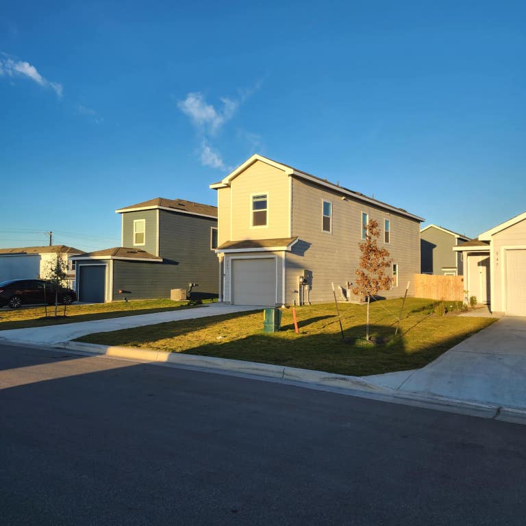 543 Commander Abbott Drive Jarrell, TX 76537 - Photo 2 of 12 a view of a house with swimming pool and a yard