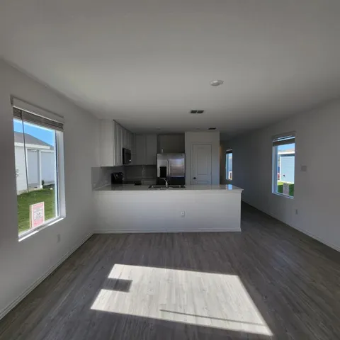 a view of kitchen with furniture and window