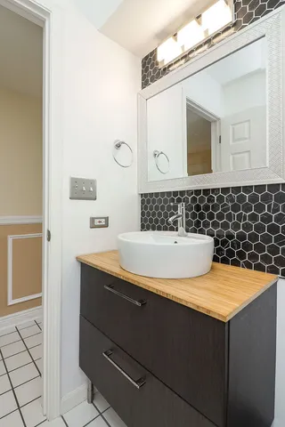 a bathroom with a sink and a mirror