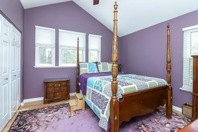 a bed room with a bed and a window