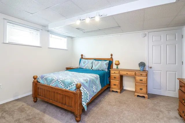 a bed room with a bed and a dresser