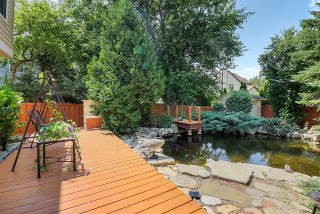 a wooden bench sitting next to a lake