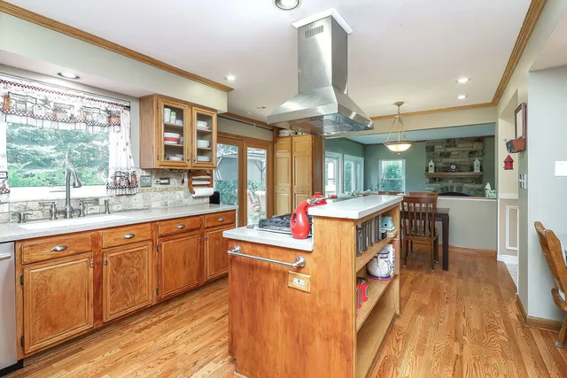a kitchen with sink a counter top space and appliances