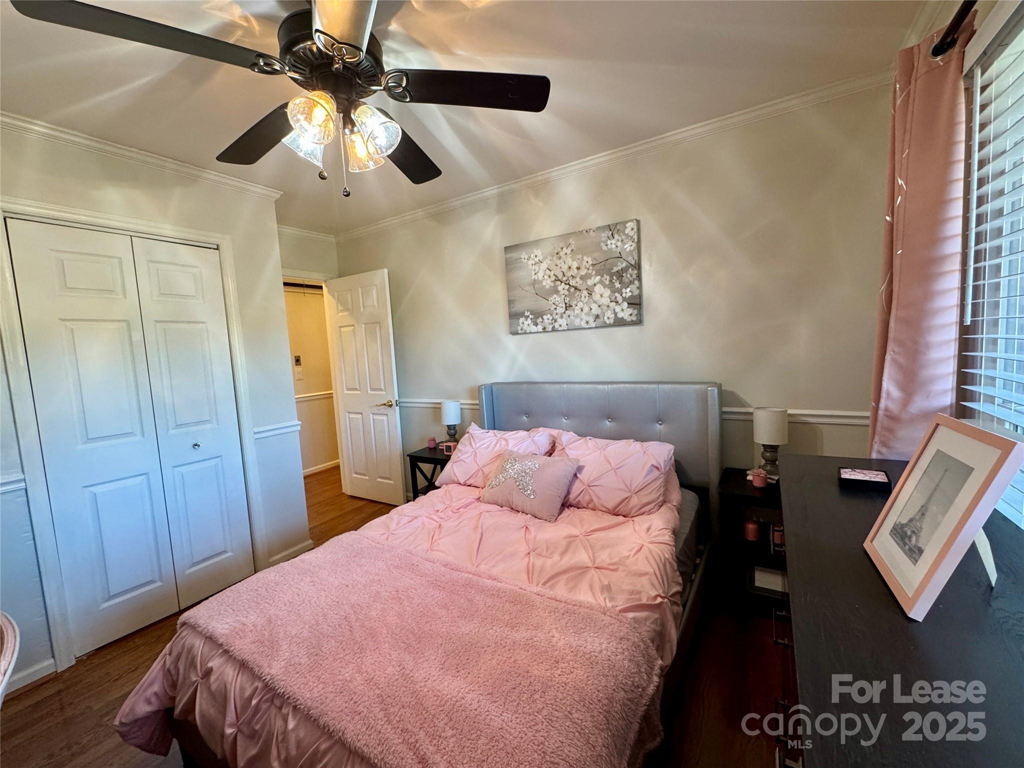 132 General Pemberton Street Mount Holly, NC 28120 - Photo 14 of 21 a bedroom with a bed and a chandelier