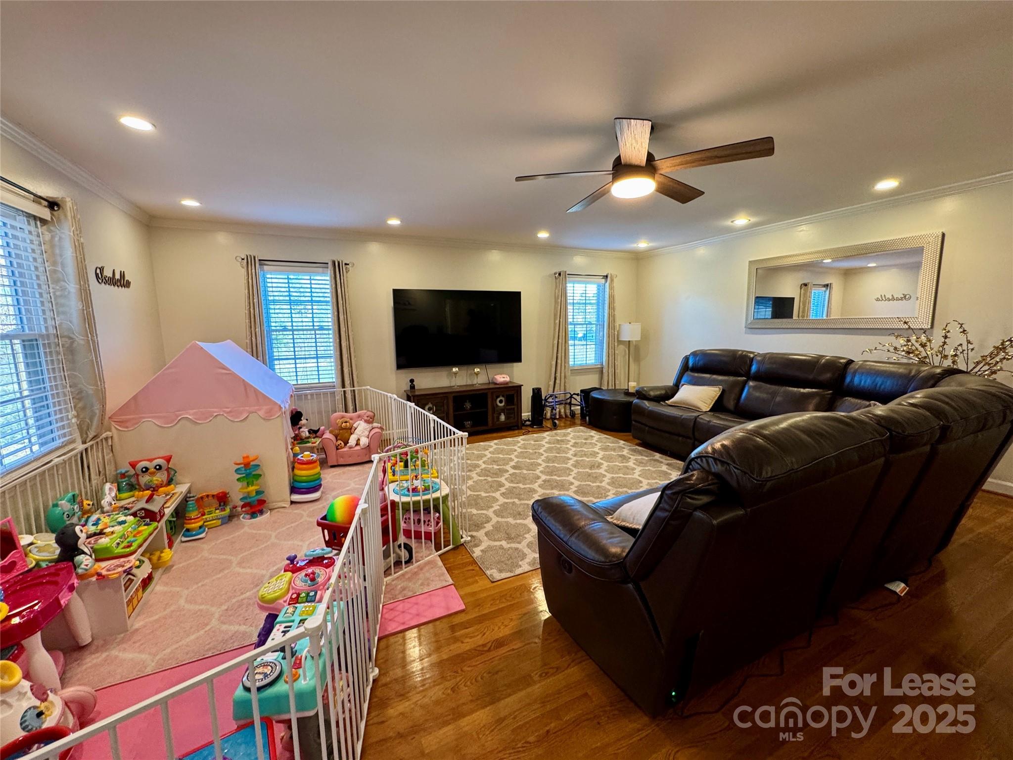 132 General Pemberton Street Mount Holly, NC 28120 - Photo 16 of 21 a living room with furniture and a flat screen tv
