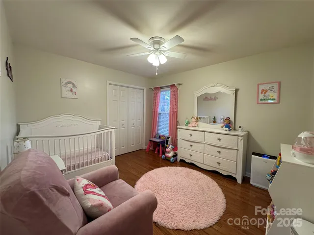 a bed room with a bed and a dresser