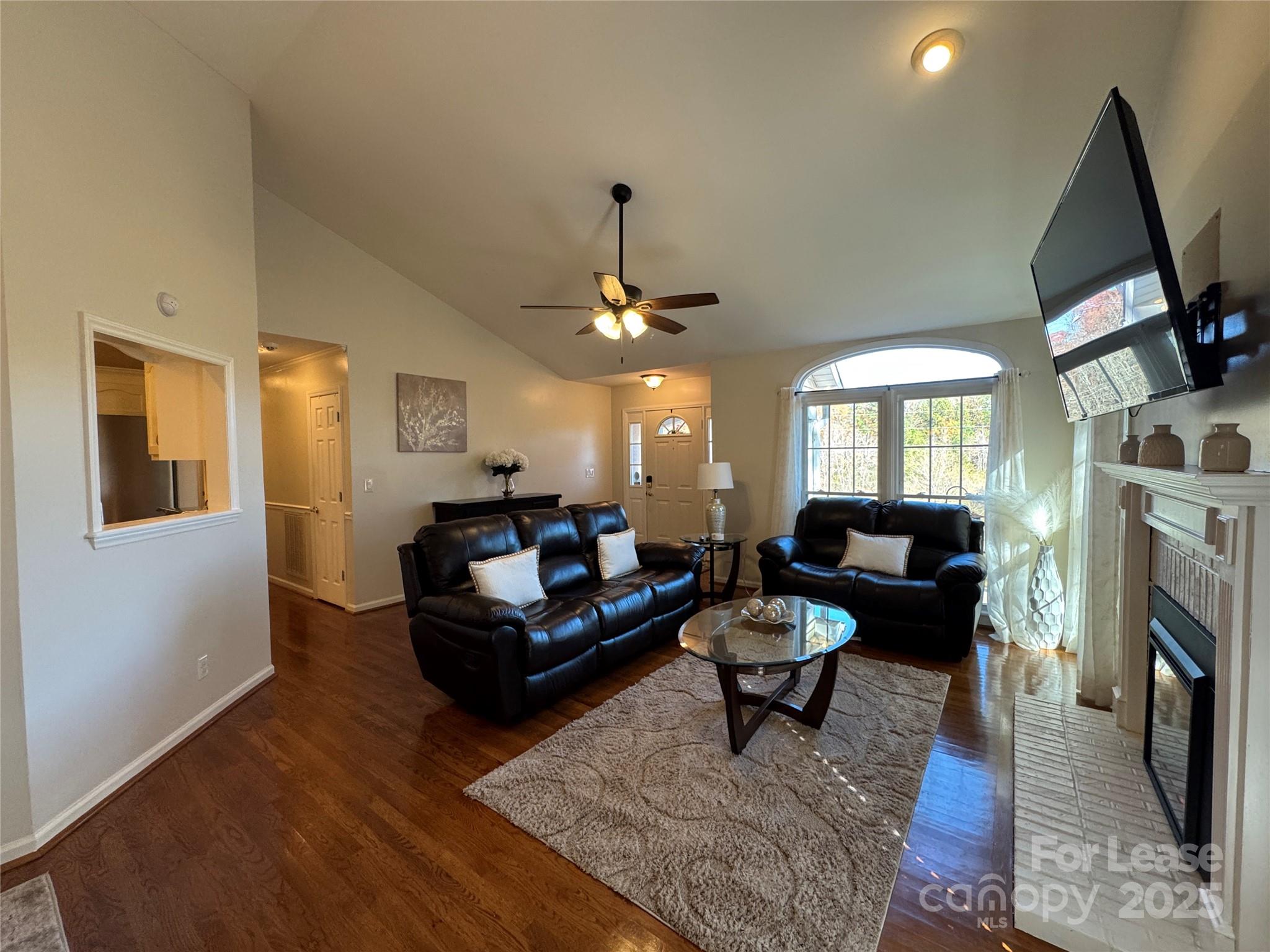 132 General Pemberton Street Mount Holly, NC 28120 - Photo 2 of 21 a living room with furniture and a fireplace