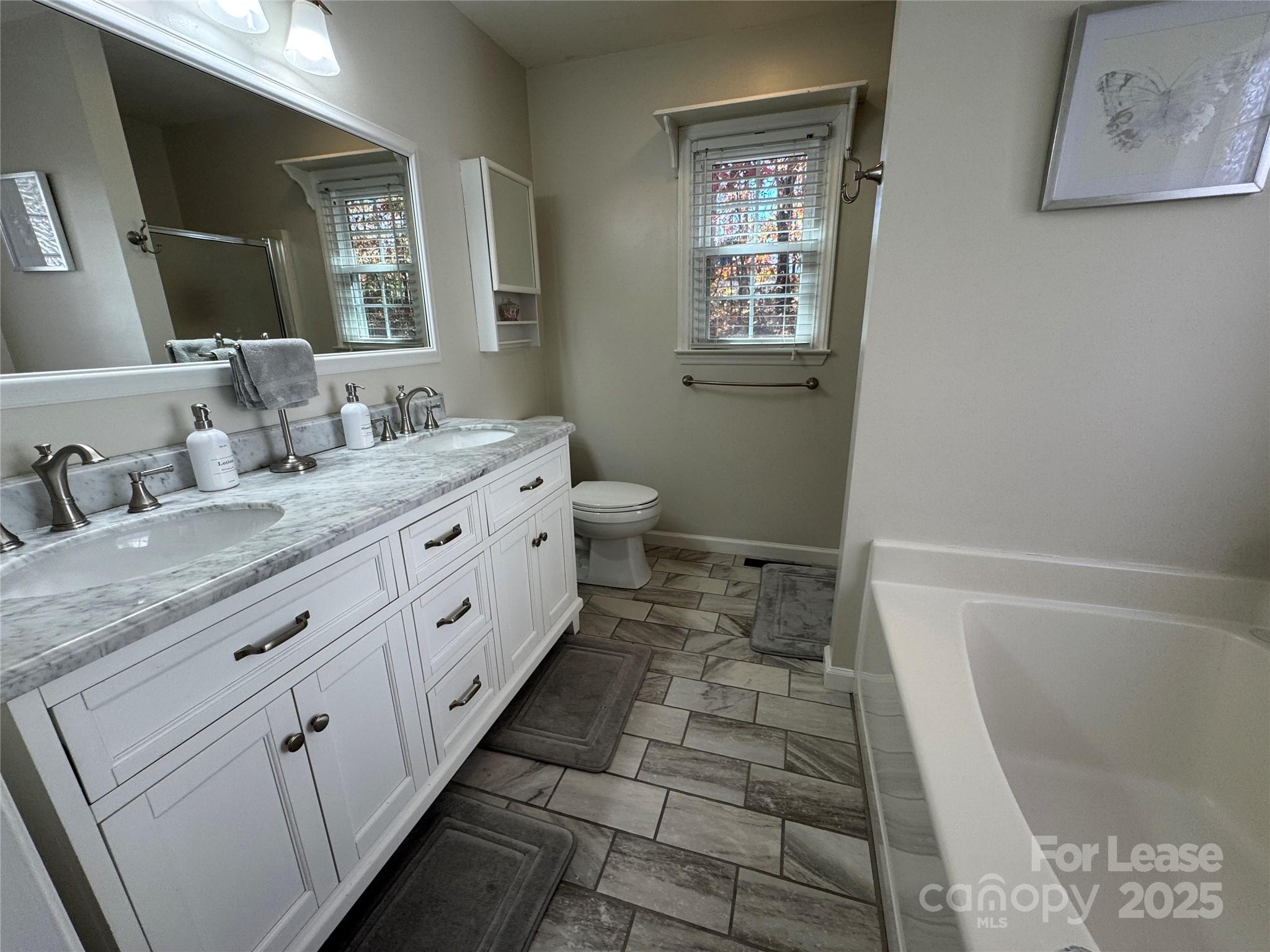 132 General Pemberton Street Mount Holly, NC 28120 - Photo 7 of 21 a bathroom with a double vanity sink and a mirror