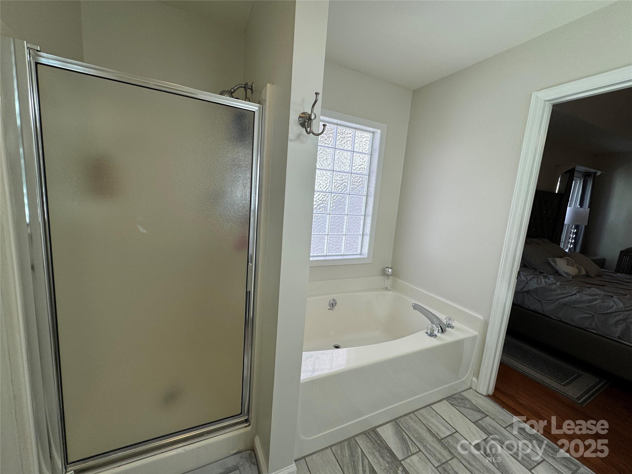 132 General Pemberton Street Mount Holly, NC 28120 - Photo 8 of 21 a bathroom with a bathtub and a shower