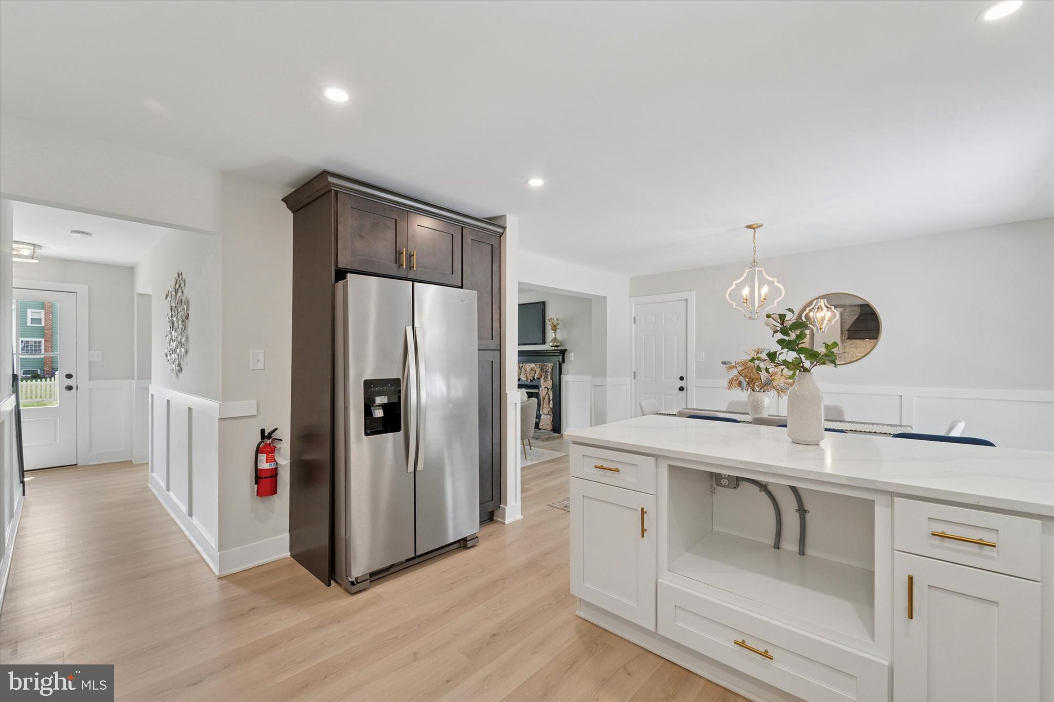 130 Walnut Avenue Pitman, NJ 08071 - Photo 14 of 35 a kitchen with a refrigerator and cabinets