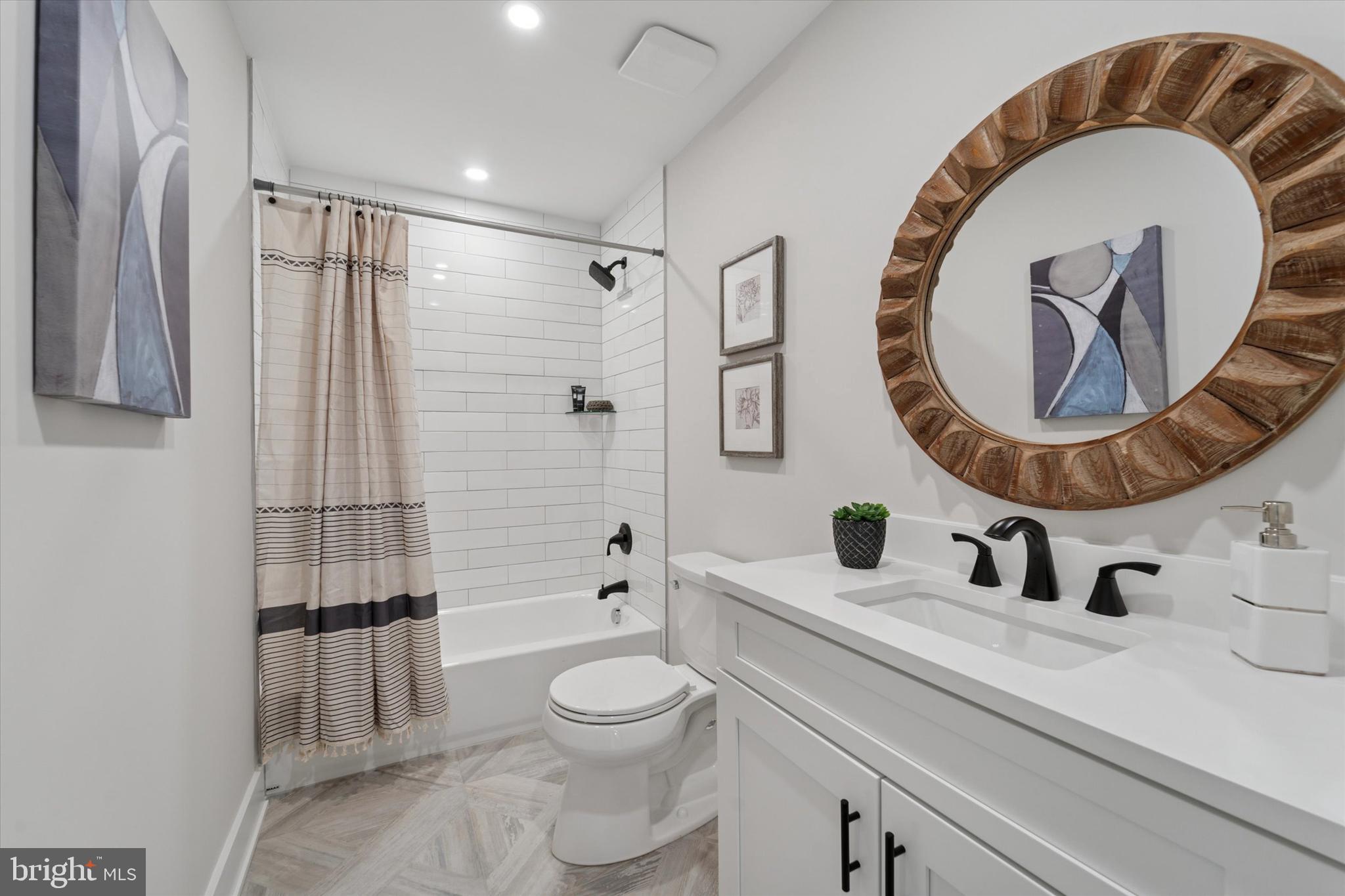 130 Walnut Avenue Pitman, NJ 08071 - Photo 18 of 35 a bathroom with a toilet sink and mirror