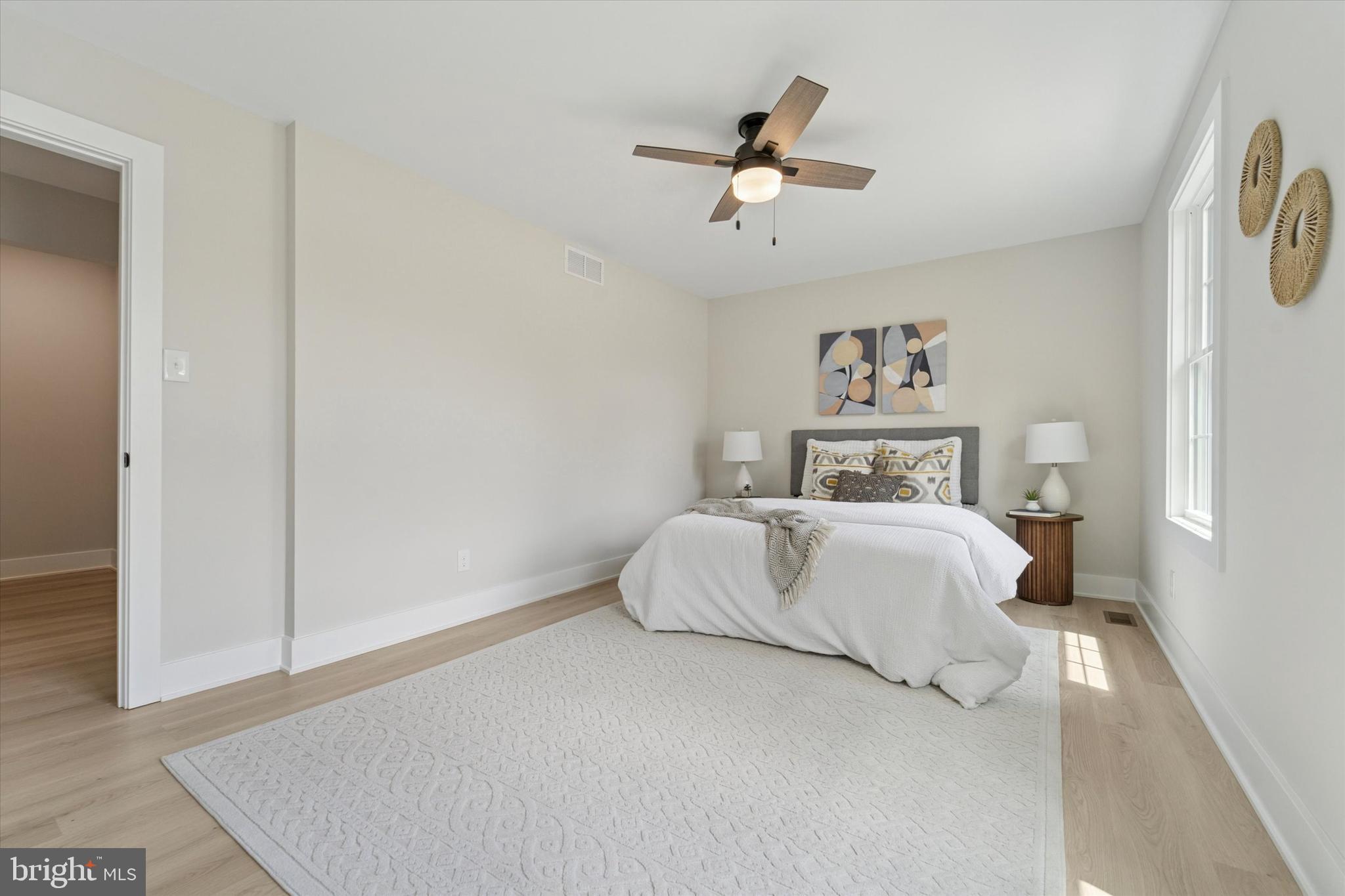 130 Walnut Avenue Pitman, NJ 08071 - Photo 20 of 35 a bedroom with a bed and a painting on the wall