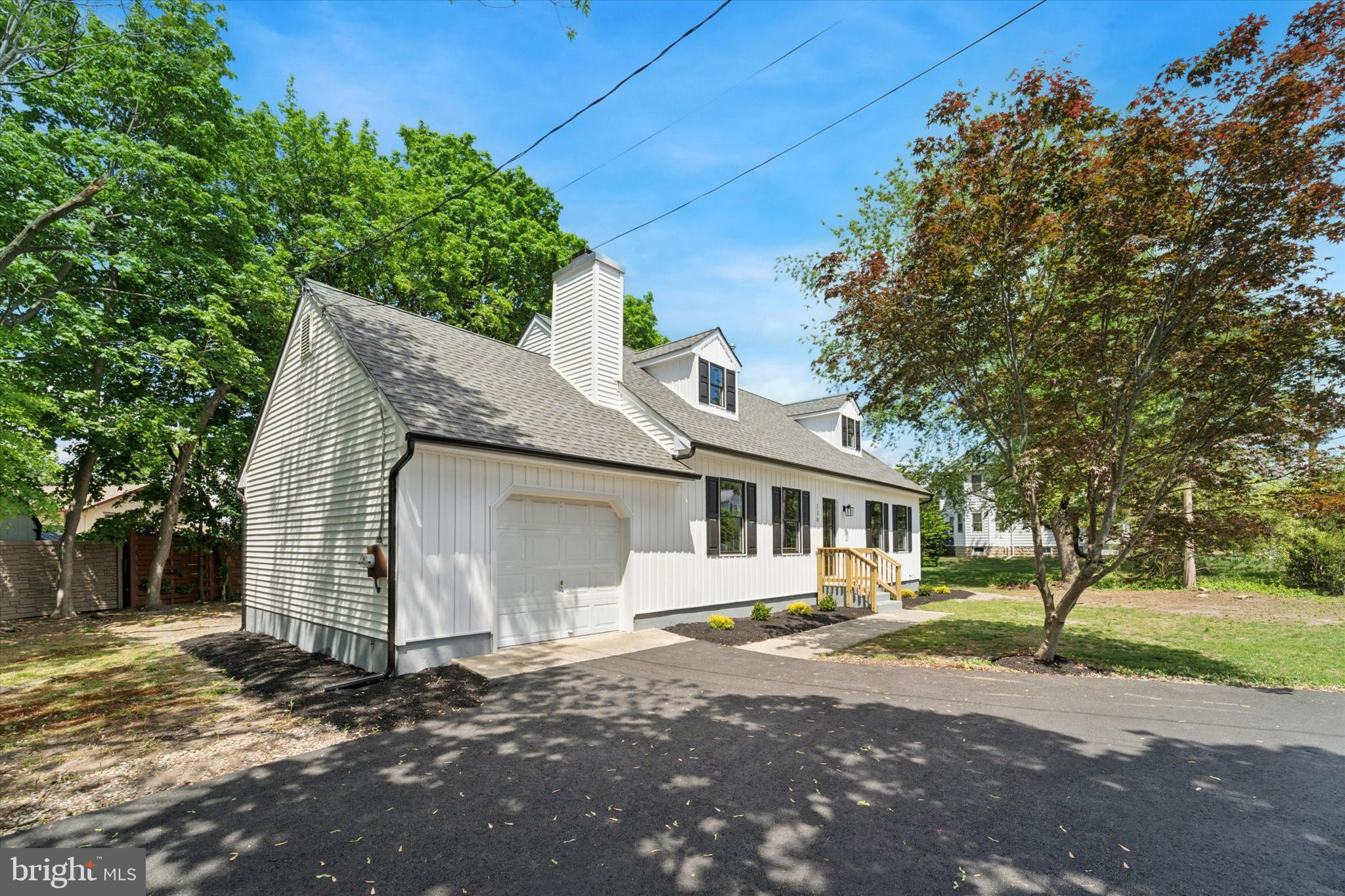 130 Walnut Avenue Pitman, NJ 08071 - Photo 2 of 35 a front view of a house with a garden