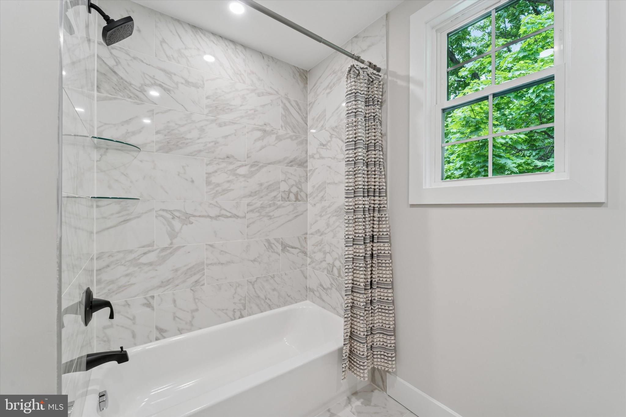 130 Walnut Avenue Pitman, NJ 08071 - Photo 25 of 35 a bathroom with a bathtub and shower