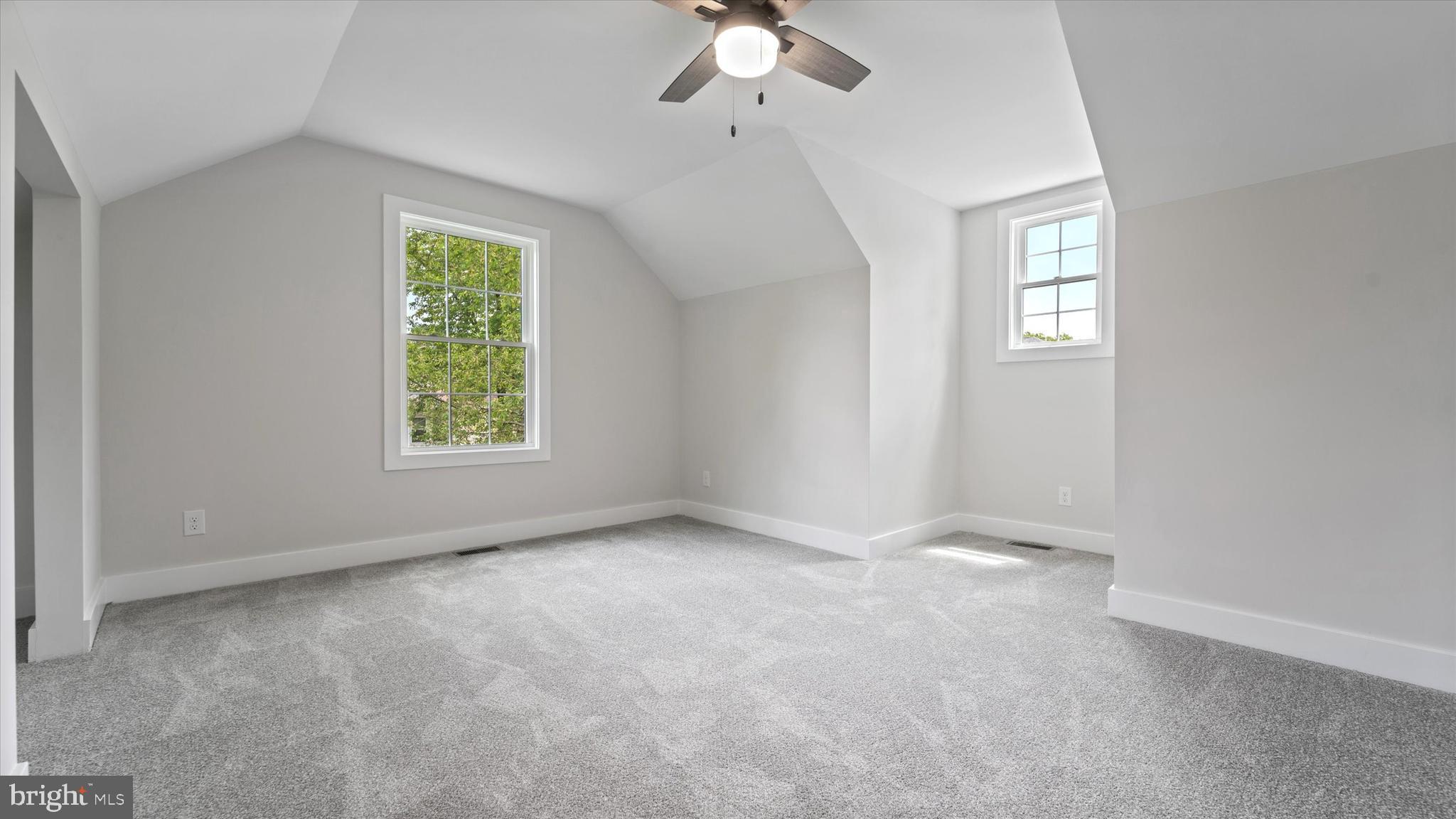 130 Walnut Avenue Pitman, NJ 08071 - Photo 30 of 35 an empty room with windows and chandelier fan