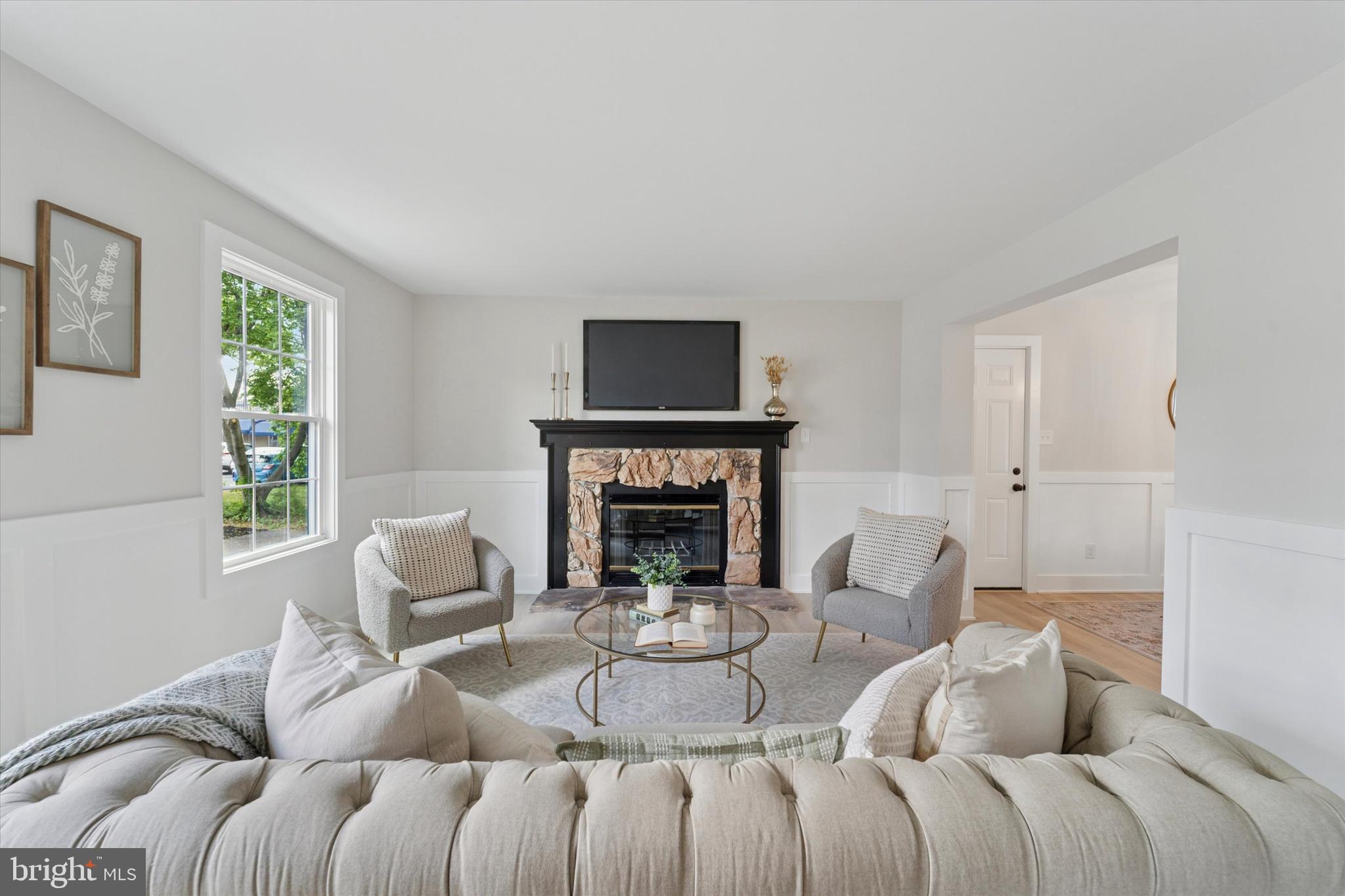 130 Walnut Avenue Pitman, NJ 08071 - Photo 3 of 35 a living room with furniture a fireplace and a large window