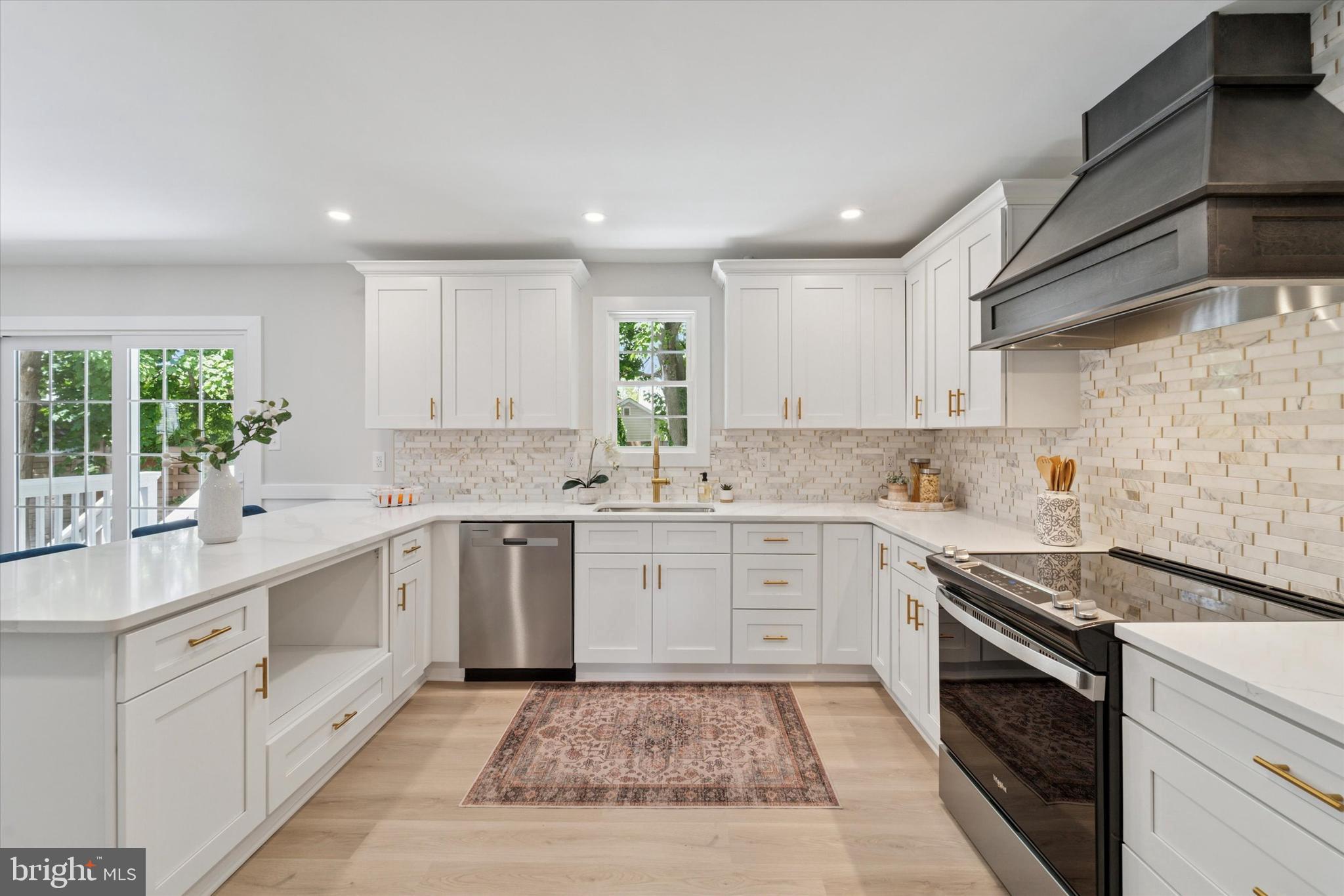130 Walnut Avenue Pitman, NJ 08071 - Photo 10 of 35 a kitchen with a sink stove and cabinets