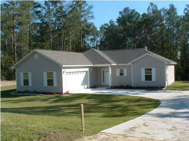 3911 High Ridge Road Crestview, FL 32539 - Photo 3 of 12 a view of house with garden and tall trees