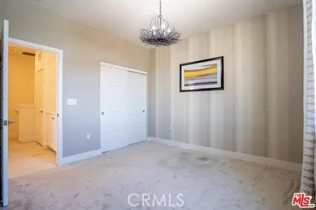a view of a hallway with a chandelier