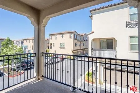 a view of a large building from a balcony
