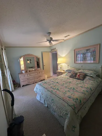 a bedroom with bed and window